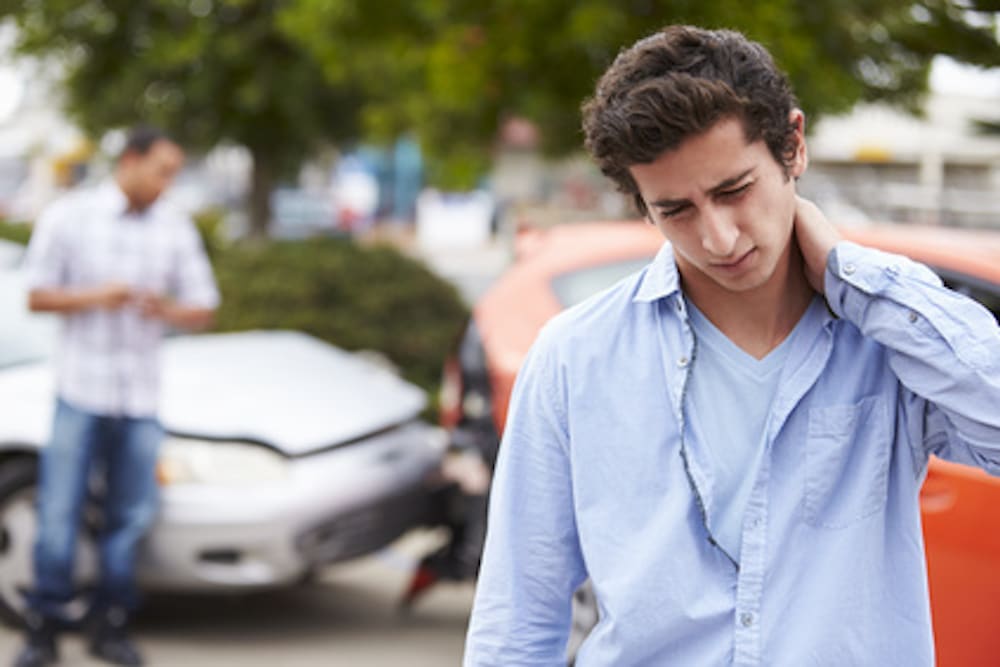 car-accident man holding neck after car accident