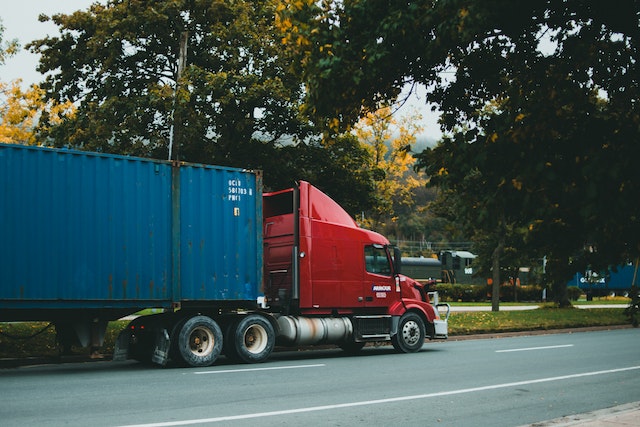 red truck with blue trailer